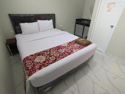 Cama o camas de una habitación en Joy Hotel