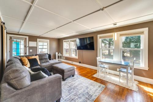 a living room with a couch and a table at 2 Mi to Colby College Peaceful Home in Waterville in Waterville