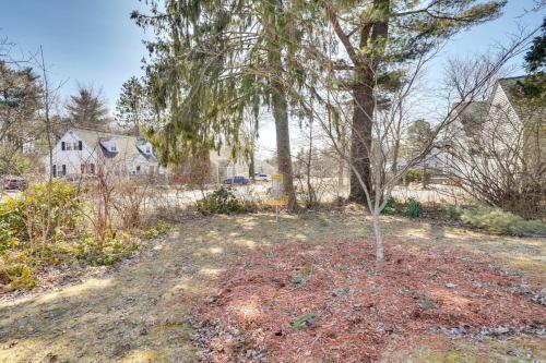 a tree in the middle of a yard at 2 Mi to Colby College Peaceful Home in Waterville in Waterville