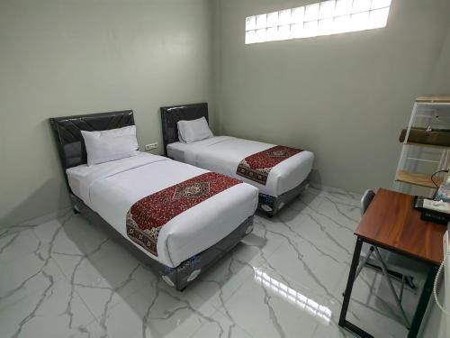 Cama o camas de una habitación en Joy Hotel