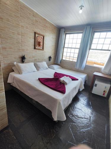Katil atau katil-katil dalam bilik di Hotel Montanhas de Minas