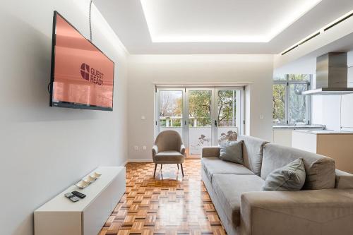 a living room with a couch and a table at GuestReady - Charming City Escape in Braga