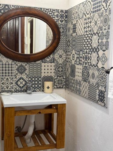 a bathroom with a sink and a mirror at Hotel Hey U in Santa Fe