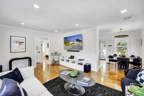 a living room with a couch and a table at Casita Lake Worth - BEACH LIFE! in Lake Worth