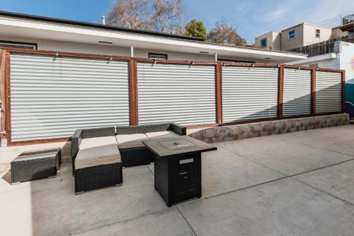 a patio with a table and chairs on a balcony at Downtown La Mesa gem in La Mesa