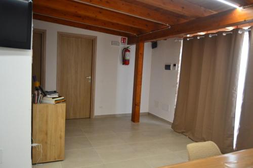 a room with a door and a room with a table at Casa Asprigna in Ficarazzi
