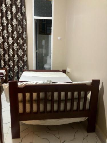 Ένα ή περισσότερα κρεβάτια σε δωμάτιο στο Nyota Safari Lodge