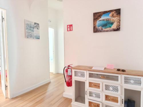 a living room with a fire extinguisher on the wall at Su e Giù Levante in Rapallo