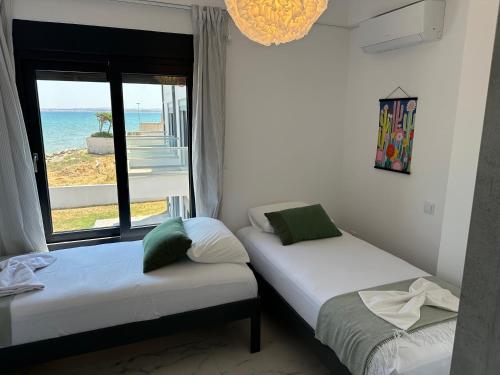 Ένα ή περισσότερα κρεβάτια σε δωμάτιο στο Villa Thea