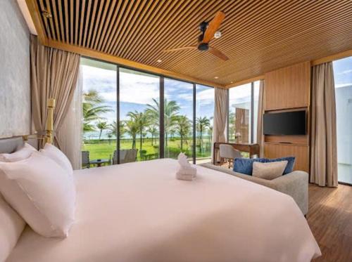 Postel nebo postele na pokoji v ubytování Beachfront Villa 3-bedroom - Breakfast buffet