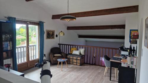 a living room with a couch and a chair at Villa Pessac Bordeaux-bassin in Pessac
