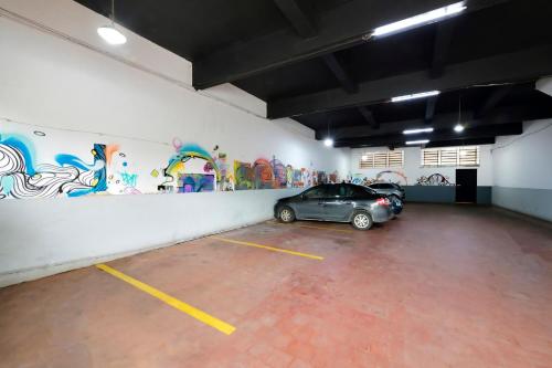 a parking garage with a car parked in it at Ribeirão Plaza Hotel in Ribeirão Preto