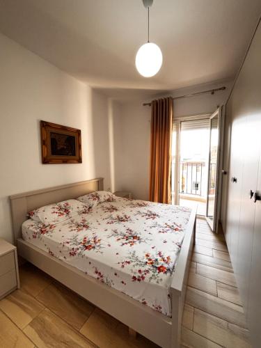 เตียงในห้องที่ Apartamenti 23