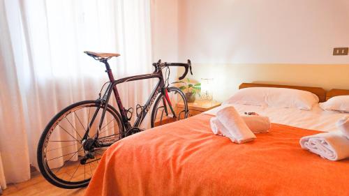 Postel nebo postele na pokoji v ubytování Albergo Dalla Mena