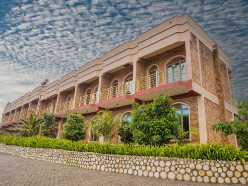 a large brick building with a sky at Hotel Saint jean Leopold Apartment in Kigali