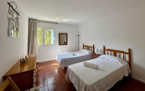 A bed or beds in a room at Home Ibiza Salou