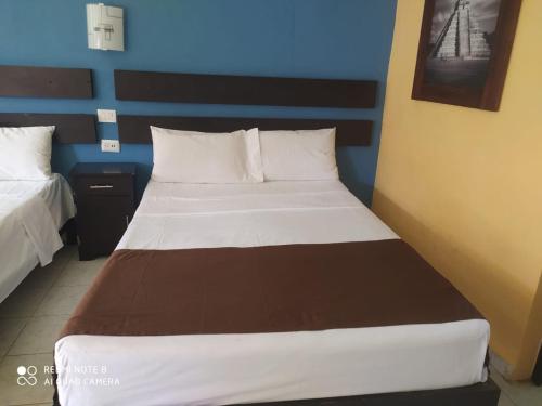 Postel nebo postele na pokoji v ubytování Hotel Posada Maya