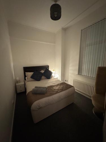 Ένα ή περισσότερα κρεβάτια σε δωμάτιο στο Hillhead Apartment