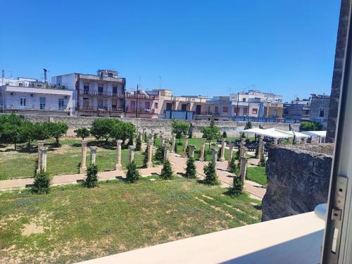 a view of a cemetery with trees and buildings at grandfather's house in Francavilla Fontana