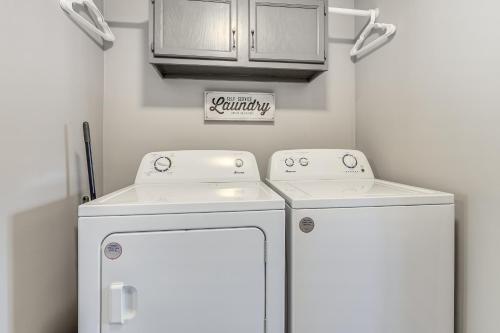a laundry room with two washer and dryer at Charming Curtis House Large Deck with Lake View! in Curtis