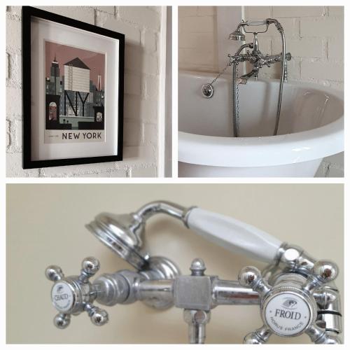 a bathroom sink with a faucet and a bath tub at Stadtvilla An der Viergelindenbrücke in Rostock