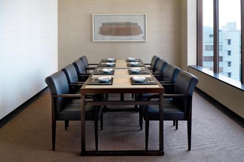 a conference room with a long table with black chairs at Westin Josun Seoul Hotel in Seoul