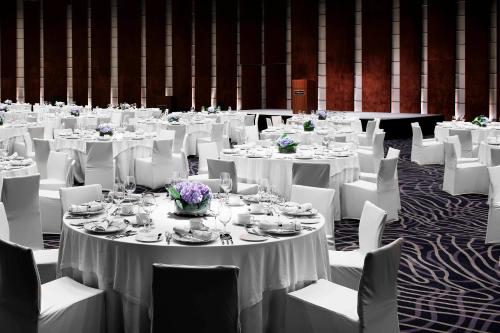 a banquet hall with white tables and white chairs at Westin Josun Seoul Hotel in Seoul