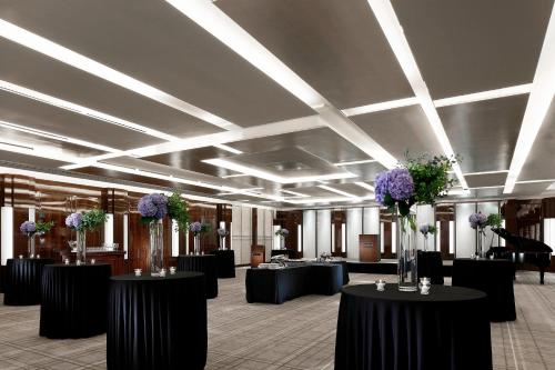 a large room with tables with flowers on them at Westin Josun Seoul Hotel in Seoul