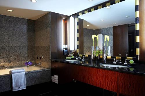 a bathroom with two sinks and a large mirror at Westin Josun Seoul Hotel in Seoul