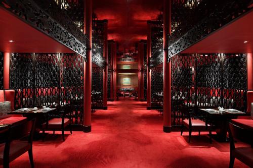 a dining room with tables and chairs and wine racks at Westin Josun Seoul Hotel in Seoul