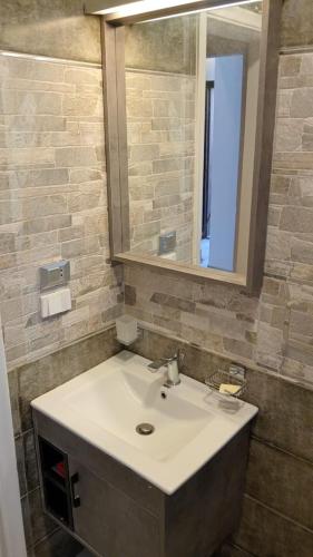 a bathroom with a sink and a mirror at Peaceful Two Bedroom Chalet in Ras Sedr