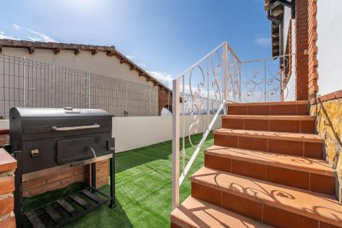 a grill on the balcony of a house at Can Prats in Ríudecañas