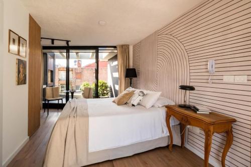 Ένα ή περισσότερα κρεβάτια σε δωμάτιο στο Monoambiente chic en Cordón Sur