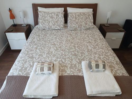 Giường trong phòng chung tại Moradia no Meco