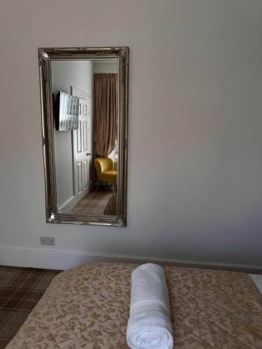Postel nebo postele na pokoji v ubytování Sandvilla Guesthouse