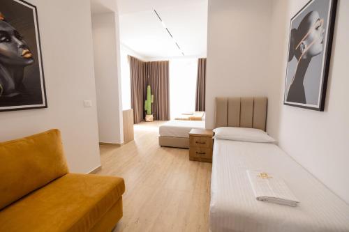 Ένα ή περισσότερα κρεβάτια σε δωμάτιο στο Sea & Sand Hotel