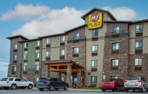 a hotel with cars parked in front of it at My Place Hotel-Kalispell, MT in Kalispell
