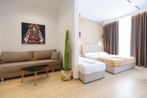 Ένα ή περισσότερα κρεβάτια σε δωμάτιο στο Sea & Sand Hotel