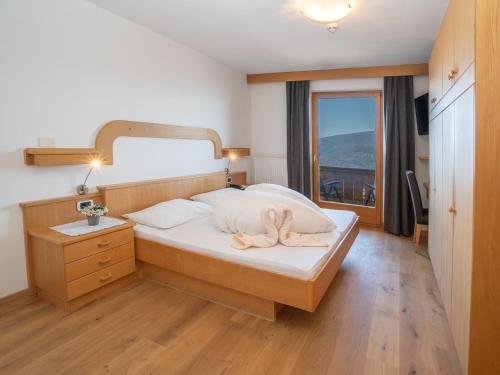 Postel nebo postele na pokoji v ubytování Hotel Purvita by Oberlechner