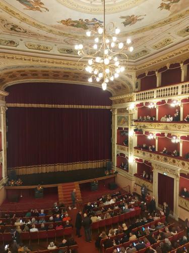an auditorium of a theatre with people sitting in it at Sikelia Suite Rooftop in Porto Empedocle