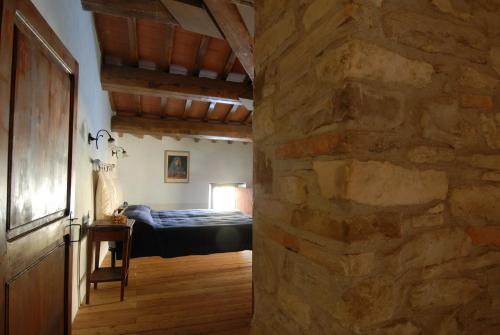 Postel nebo postele na pokoji v ubytování Bioagriturismo Chignoni