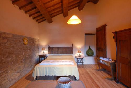 Postel nebo postele na pokoji v ubytování Bioagriturismo Chignoni
