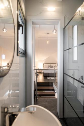 a bathroom with a sink and a mirror at Villa Sunset Albatross in Nea Potidaea