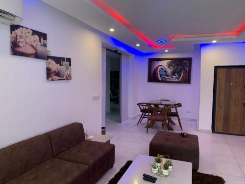 a living room with a couch and a table at Presken Luxury Apartments in Lagos