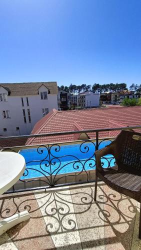 a view of a swimming pool from a balcony at Villa Ureki in Ureki