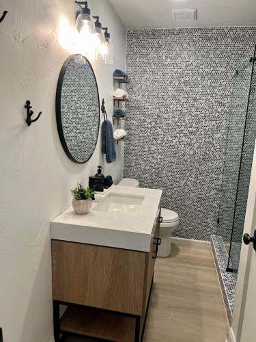 a bathroom with a sink and a shower at Harbor Point Hideaway,Sleeps 8, on open water in Gun Barrel City