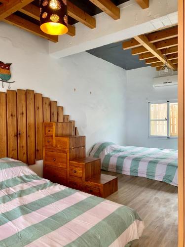 Ένα ή περισσότερα κρεβάτια σε δωμάτιο στο Maison d'Amour 愛的筵宴所