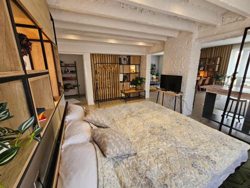 a bedroom with a large bed in a room at studio49apartments in Niš