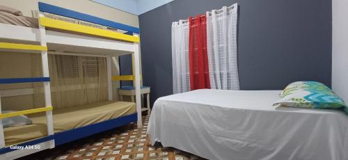 Postel nebo postele na pokoji v ubytování Cabaña Vistas del Bosque jarabacoa