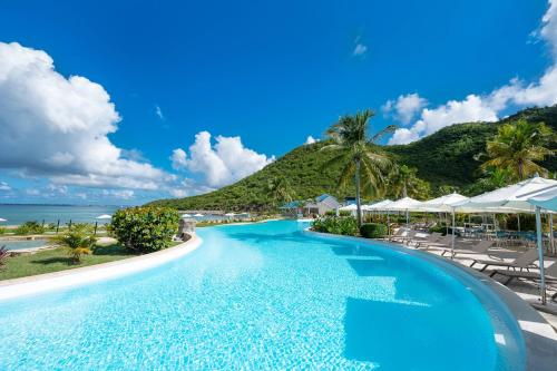 a pool at the resort at St Martin Beach Resort & Spa in Anse Marcel 